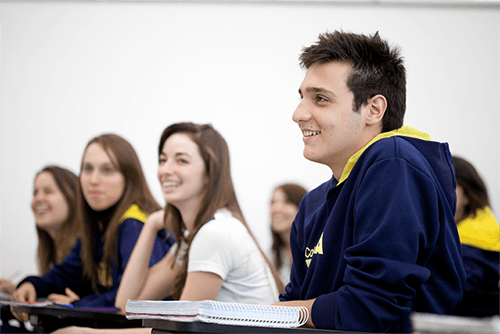 Engaged high-school students in a modern classroom during an advanced lesson